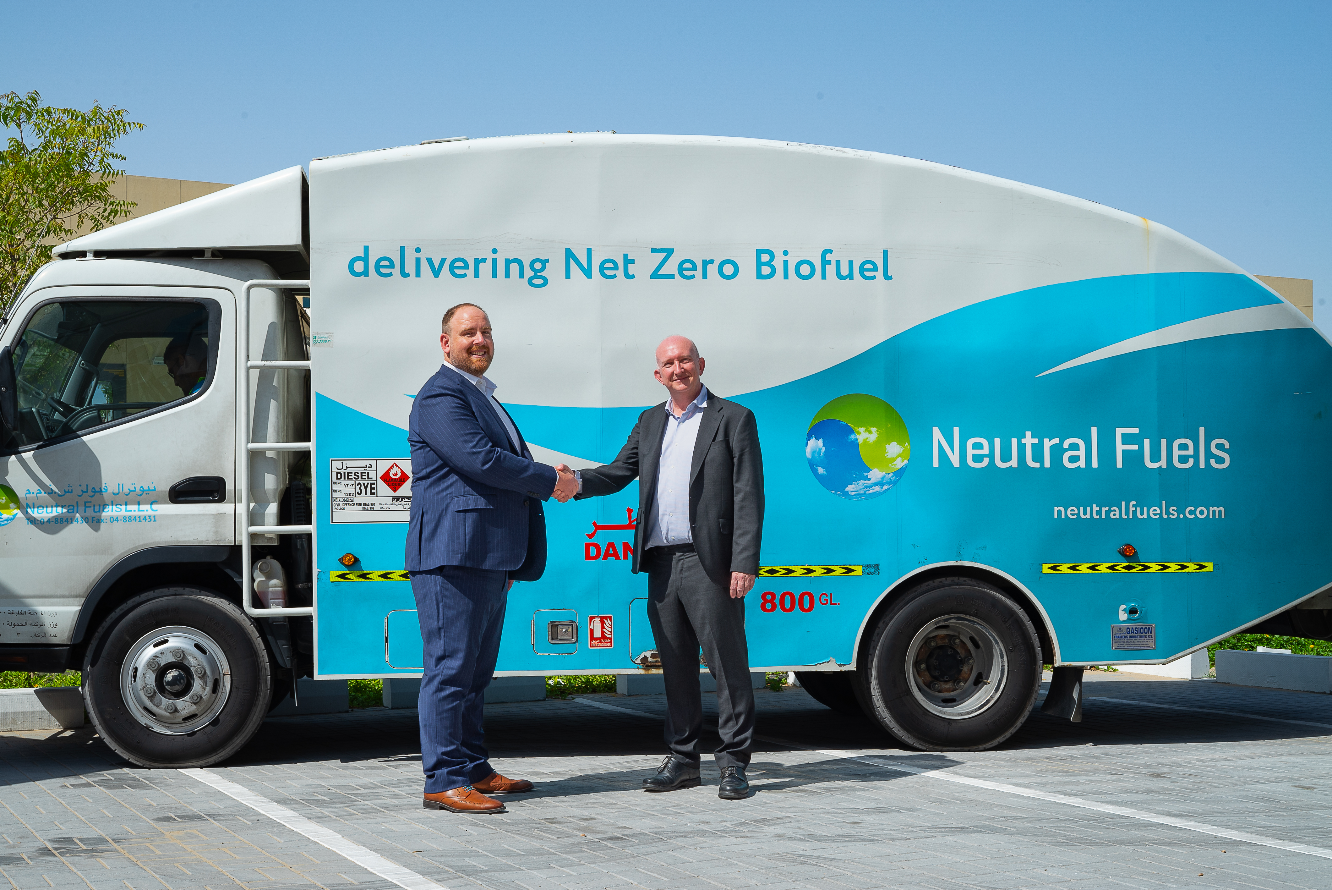 Jason Evans, GM Crown Middle East and Charles Gardner, COO, Neutral Fuels standing alongside a Neutral Fuels truck in Dubai, UAE 