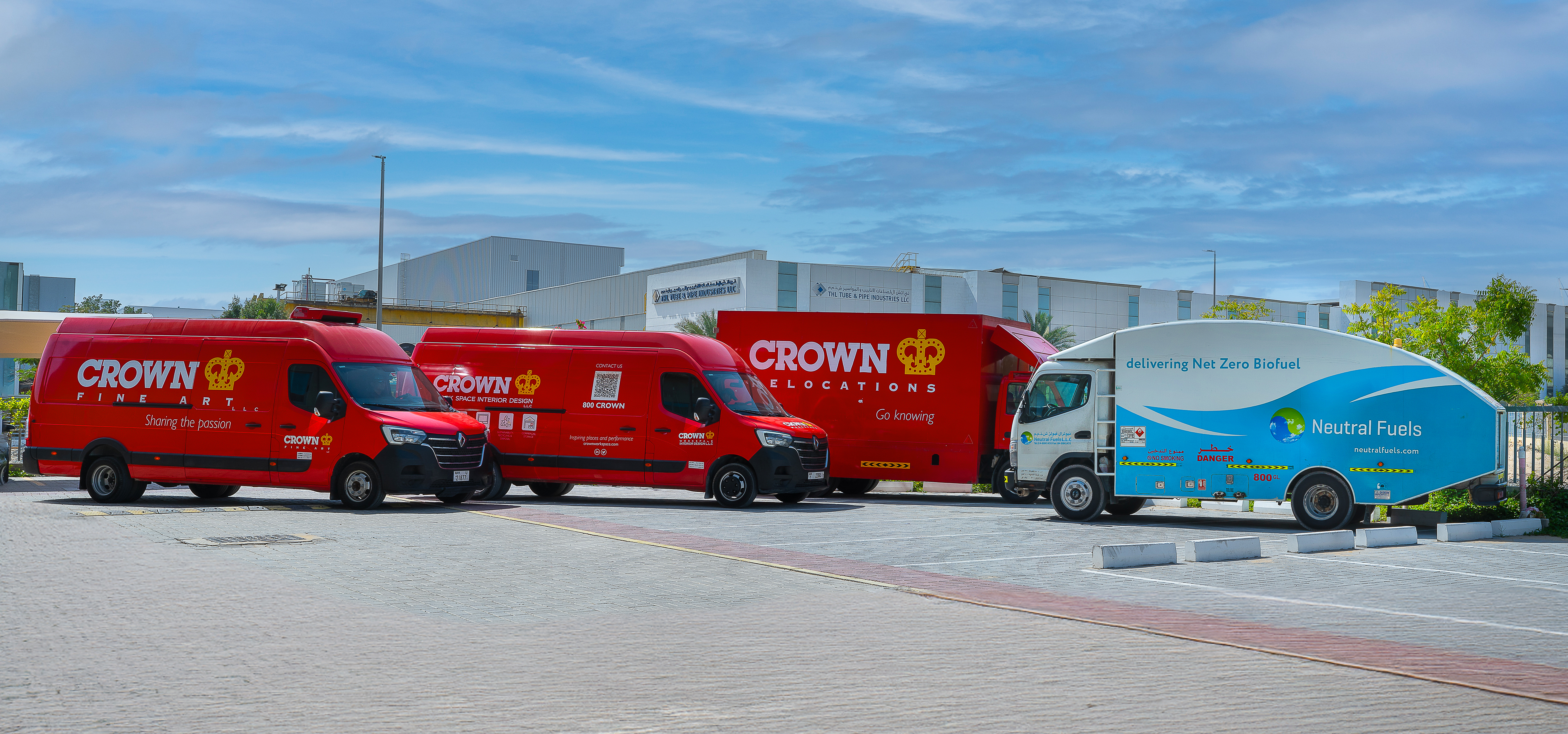 Crown Relocations, Fine Art and Workspace Trucks alongside a Neutral Fuels truck in Dubai, UAE
