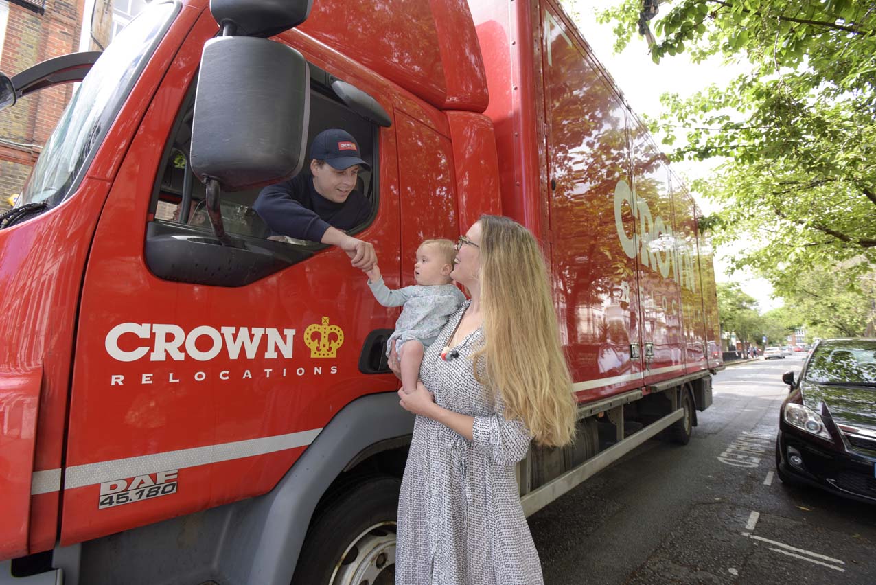 Crown Relocations driver greeting a family 