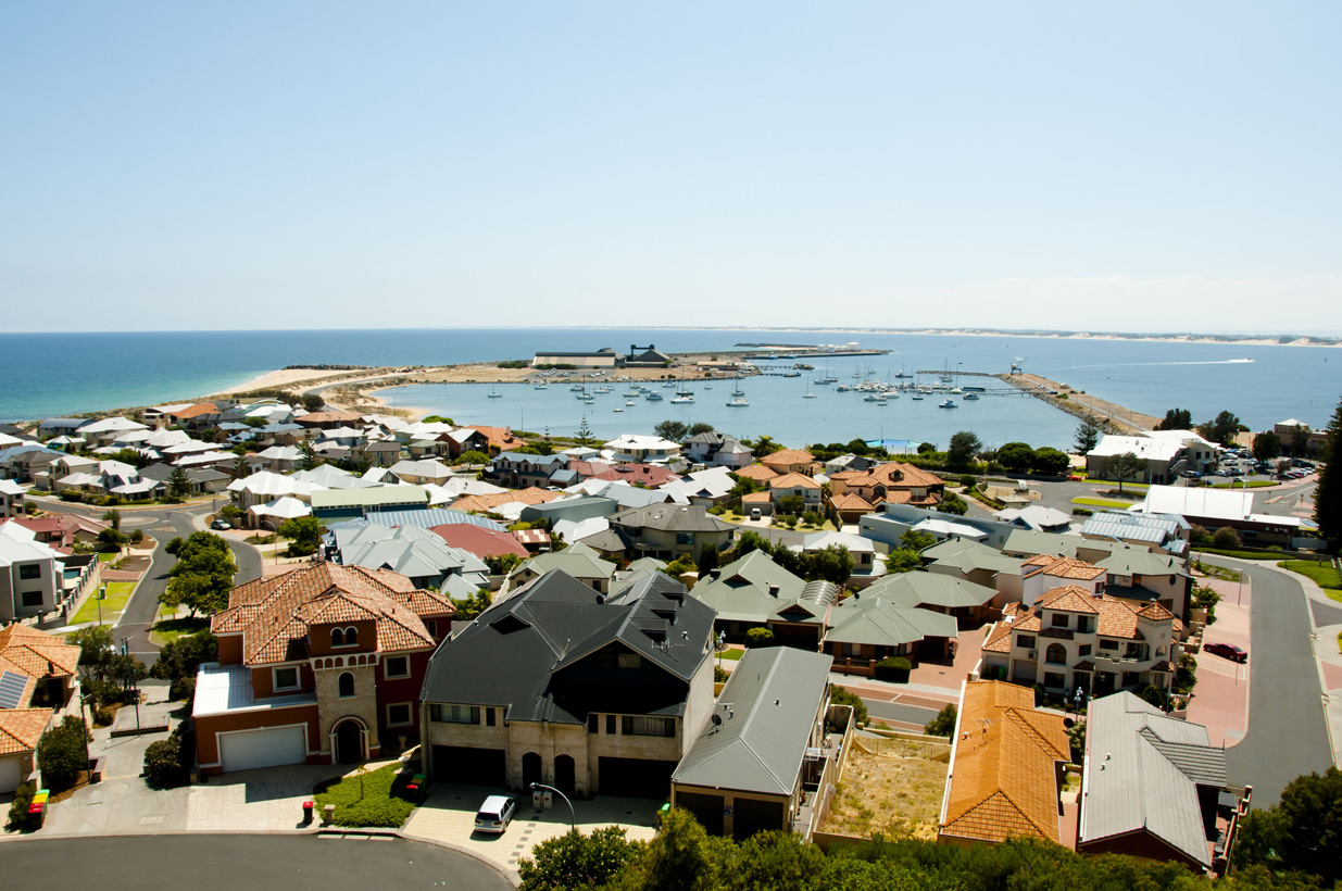 Ariel view of houses close to a harbour in Australia