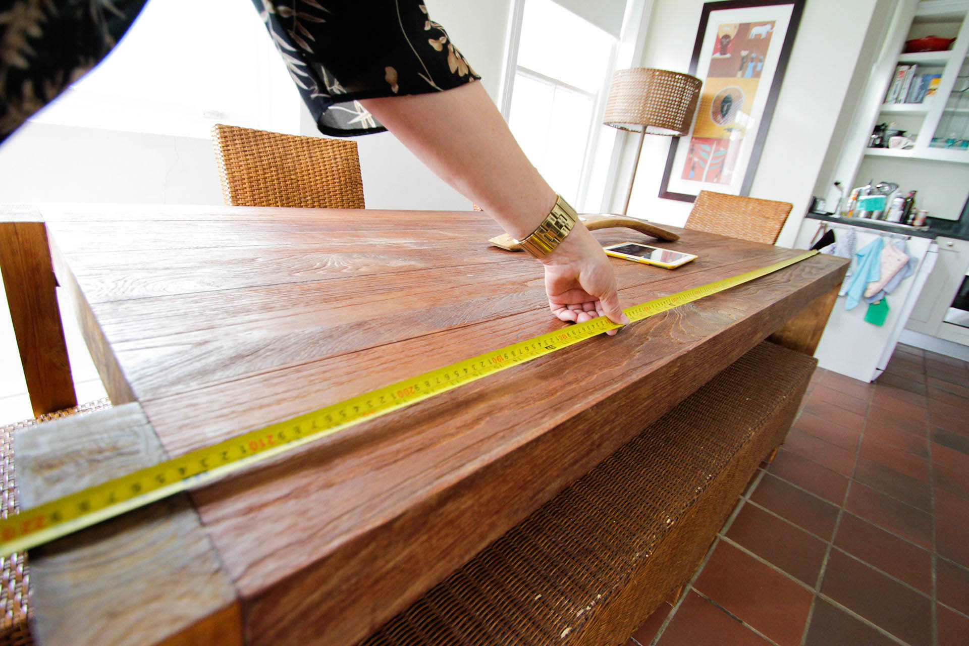 man measuring table for packing